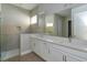 Modern bathroom with double vanity and large shower at 10049 Ballast Dr, Orlando, FL 32827