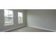 Well-lit bedroom featuring neutral walls and wood-look flooring at 10049 Ballast Dr, Orlando, FL 32827