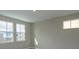 Bright bedroom with neutral walls, carpet, and two windows at 10049 Ballast Dr, Orlando, FL 32827