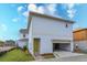 Attached garage with yellow door and open garage door at 10049 Ballast Dr, Orlando, FL 32827