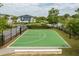 Outdoor basketball court featuring a green surface with white lines, perfect for enjoying recreational games at 10079 Gobat Aly, Orlando, FL 32827