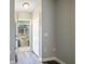 Bright entryway with white door and gray walls leading to the outside at 1015 Stucki Ter, Winter Garden, FL 34787