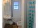 Cozy bathroom features a sink and toilet with a shower at 11221 Lake Eustis Dr, Leesburg, FL 34788