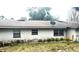 Rear view of house showing roof and satellite dish at 11221 Lake Eustis Dr, Leesburg, FL 34788