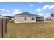 House exterior with large backyard and screened porch at 11272 Stewart Loop, Oxford, FL 34484