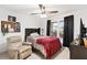 Relaxing bedroom with plaid bedding and window at 11272 Stewart Loop, Oxford, FL 34484