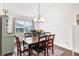 Bright dining area with a charming wooden table and chandelier at 11272 Stewart Loop, Oxford, FL 34484