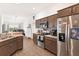 Modern kitchen with stainless steel appliances and an island at 11272 Stewart Loop, Oxford, FL 34484