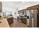 Modern kitchen with stainless steel appliances and island at 11272 Stewart Loop, Oxford, FL 34484