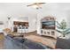 Living room with kitchen view, hardwood floors, and seating at 11272 Stewart Loop, Oxford, FL 34484