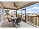 Spacious screened porch with outdoor furniture and view of neighborhood at 11272 Stewart Loop, Oxford, FL 34484