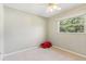 Bedroom with neutral walls, carpeting, a ceiling fan and a bright window at 118 Shomate Dr, Longwood, FL 32750