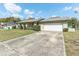 Side view of this house with large driveway and two car garage at 118 Shomate Dr, Longwood, FL 32750