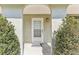 Close up of front door with glass panes and welcoming plants at 118 Shomate Dr, Longwood, FL 32750