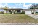 Charming single-story home with a well-maintained lawn and attached two-car garage at 118 Shomate Dr, Longwood, FL 32750