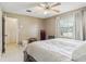 Cozy main bedroom featuring plush carpet and a ceiling fan, enhancing warmth at 118 Shomate Dr, Longwood, FL 32750