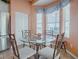 Breakfast nook with glass table and chairs in a bright kitchen at 12060 Se 176Th Loop, Summerfield, FL 34491