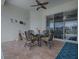 Relaxing patio with seating area and glass sliding doors at 12060 Se 176Th Loop, Summerfield, FL 34491