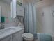 Clean bathroom with tub, shower, and white vanity at 1218 Augustine Dr, The Villages, FL 32159