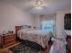 Bedroom with double bed, wood furniture, and ceiling fan at 1218 Augustine Dr, Lady Lake, FL 32159