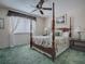 Bedroom with four-poster bed and ceiling fan at 1235 Avenida De Las Casas, The Villages, FL 32159