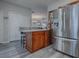 Modern kitchen with stainless steel appliances and granite countertops at 1235 Avenida De Las Casas, The Villages, FL 32159