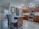 Modern kitchen with stainless steel appliances and granite countertops at 1235 Avenida De Las Casas, The Villages, FL 32159