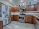 Modern kitchen with stainless steel appliances and granite countertops at 1235 Avenida De Las Casas, The Villages, FL 32159