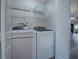 Laundry room with washer, dryer, and shelving at 1235 Avenida De Las Casas, The Villages, FL 32159