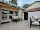 Relaxing patio with seating area and awning at 1235 Avenida De Las Casas, The Villages, FL 32159