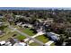 Wide aerial view of the home and surrounding neighborhood near the water at 12430 Blue Heron Way, Leesburg, FL 34788