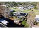 Aerial view of a canal-front home with a pool and solar panels at 12430 Blue Heron Way, Leesburg, FL 34788