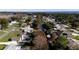 Aerial view of a waterfront community with houses and a canal at 12430 Blue Heron Way, Leesburg, FL 34788