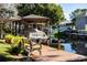 Covered boat dock with a bench overlooking a serene canal at 12430 Blue Heron Way, Leesburg, FL 34788