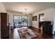 Bright dining room with hardwood floors and view of the pool at 12430 Blue Heron Way, Leesburg, FL 34788