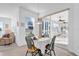 Bright breakfast nook with table and chairs, view to screened porch at 12592 Se 97Th Terrace Rd, Summerfield, FL 34491