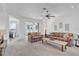 Living room with plaid couches and view of golf course at 12592 Se 97Th Terrace Rd, Summerfield, FL 34491