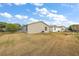 View of the backyard, showing the homes behind it at 1280 Mount Vernon Way, The Villages, FL 32162