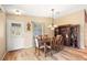 Bright dining room with hardwood floors and a wooden table at 1280 Mount Vernon Way, The Villages, FL 32162