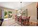 Dining room with hardwood floors and view of the backyard at 1280 Mount Vernon Way, The Villages, FL 32162