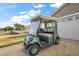 Golf cart parked in the driveway of the home at 1280 Mount Vernon Way, The Villages, FL 32162