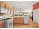 Bright kitchen with light wood cabinets and an open layout at 1280 Mount Vernon Way, The Villages, FL 32162