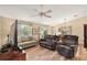 Open concept living room with hardwood floors and a view of the kitchen at 1280 Mount Vernon Way, The Villages, FL 32162