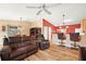 Light-filled living room featuring hardwood floors and a comfortable seating area at 1280 Mount Vernon Way, The Villages, FL 32162