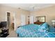 Spacious bedroom with en-suite bathroom and a TV at 1280 Mount Vernon Way, The Villages, FL 32162