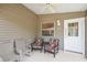 Relaxing screened porch with comfortable seating at 1280 Mount Vernon Way, The Villages, FL 32162