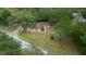 Aerial view of house and surrounding trees at 13588 Sw 105Th Pl, Dunnellon, FL 34432