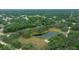 Aerial view showing home nestled in a lush, wooded area at 13588 Sw 105Th Pl, Dunnellon, FL 34432