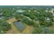 Aerial view highlighting home's location near a pond at 13588 Sw 105Th Pl, Dunnellon, FL 34432