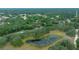 Aerial view of property, showing home near a pond at 13588 Sw 105Th Pl, Dunnellon, FL 34432